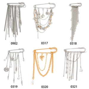 Set of six punk style safety pin brooches with rhinestones and star tassel charms