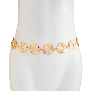 Detail of punk gold waist chain with textured hollow circular discs on white mannequin