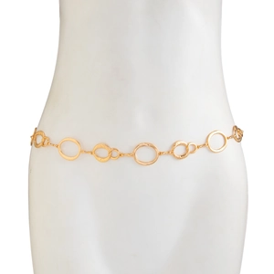 Detail of gold metal waist chain featuring polished and hammered circular links on model