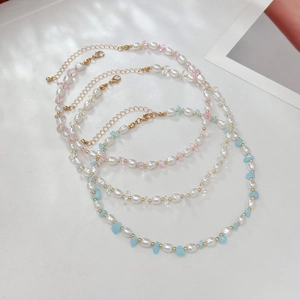 Kralenketting set met zoetwaterparels, turquoise accenten en gouden kralen