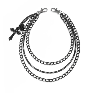 Gothic multilayer waist chain with black metal cross and skull pendants on white backdrop
