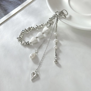 Detail of multi-layer beaded chain with silver CCB beads and white heart pendants