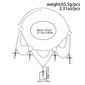 Macro detail of gothic cross pendants with silver filigree and size specifications
