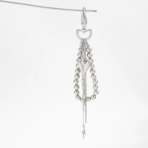 Silver multi-layer bag charm featuring a heart pendant and small lightning bolt charms