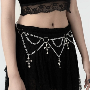 Detail of gothic silver metal body chain featuring layered cross pendants and rings