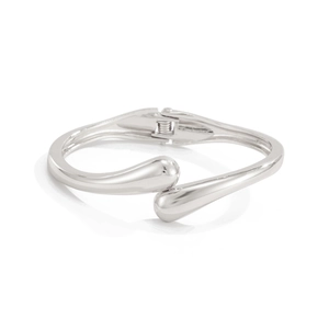 Polished silver teardrop spring cuff bracelet with geometric asymmetrical overlap design