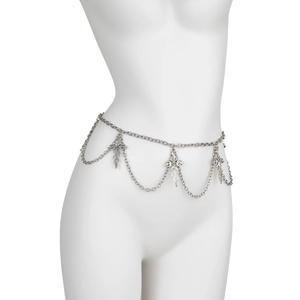 Detail of silver body chain featuring gothic cross pendants and flame design on model
