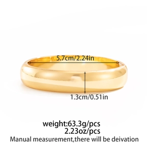 Polished gold wide cuff bangle showing precise dimensions of 5.7cm diameter and 1.3cm width