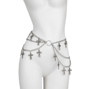 Detail of silver multilayered waist chain featuring gothic cross pendants and metal rings