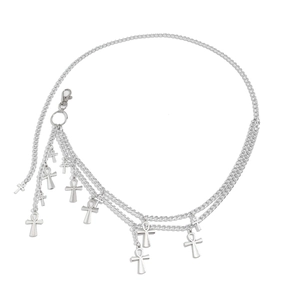 Close-up of gothic silver layered body chain with Ankh and cross pendants