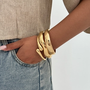 Polished gold wide cuff bracelets set with exaggerated geometric wave design for women