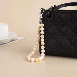 Minimalist handmade beaded bag strap with amber-texture acrylic beads and silver clasp