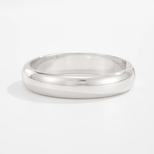 Macro detail of glossy polished silver water drop bangle with a side hinge mechanism