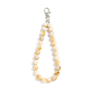 Detail of beaded keychain with amber marble texture acrylic beads and silver lobster clasp
