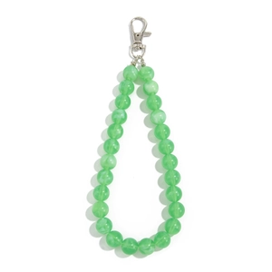 Close-up of translucent green marble texture acrylic beads with silver lobster clasp