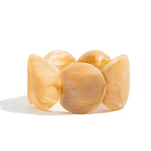 Detail view of marble textured resin tiles on a retro stretch bracelet with amber patterns