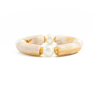 Detail of beaded bracelet with marble texture resin tubes, pearls and gold spacers
