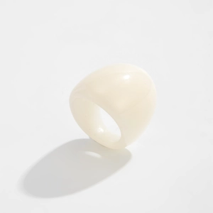 Close-up of minimalist creamy white chunky resin ring with smooth polished finish