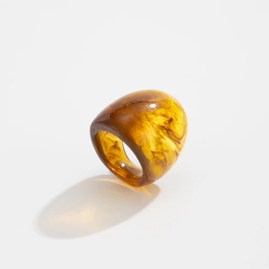 Close-up of thick amber resin ring showing realistic tortoise shell marble texture