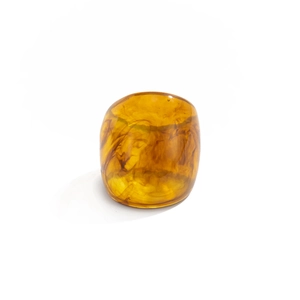 Macro detail of amber resin ring featuring thick marble pattern and glossy finish
