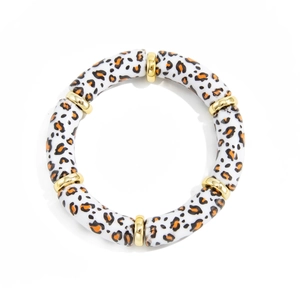 Detail of leopard print acrylic bracelet with elegant gold-tone metal spacers