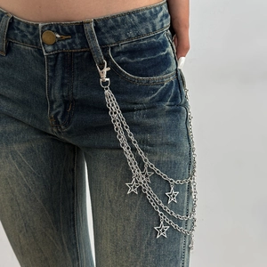 Punk style multi-layer silver metal pants chain with star charms on blue jeans