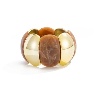 Detail of amber resin and gold metal blocks on a vintage stretch bracelet