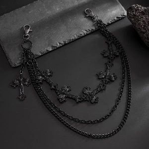 Detail of gothic multi-layer black metal pants chain with cross pendants and lobster clasps