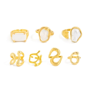 Set of 7 gold liquid metal rings with baroque pearls in irregular geometric designs
