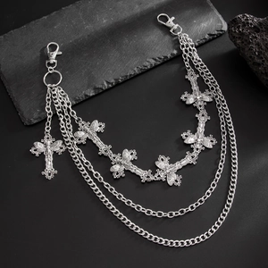 Detail of vintage silver multi-layer metal pants chain with gothic cross pendants