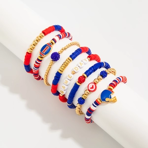 Close-up of a 5-piece Game Day football bracelet set with acrylic beads and charms