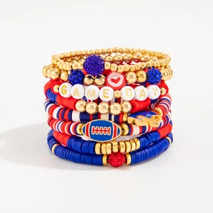 Stack of seven patriotic Game Day beaded bracelets with football and heart charms