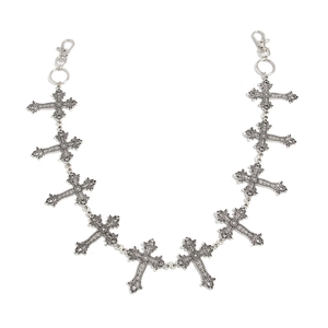 Detail of vintage silver pants chain with gothic cross pendants and lobster clasps