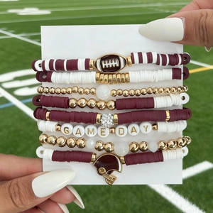 Detail of 8-piece football bracelet set with wine red beads and Game Day charms