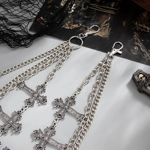 Close-up of gothic punk layered metal trousers chain with cross charms and silver finish