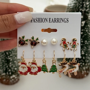 Detailed set of six pairs of Christmas earrings featuring reindeer, Santa, and trees