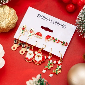 Detailed set of Christmas earrings featuring reindeer, Santa, and gingerbread man icons
