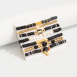 Detail of 7-piece Game Day bracelet set with football charms and acrylic beads