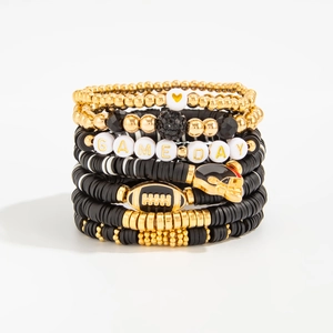 Detail of multi-layer beaded bracelet set featuring football charms and GAME DAY letters
