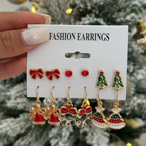 6-pair set of Christmas earrings with Santa, reindeer, and snowflakes on a display card