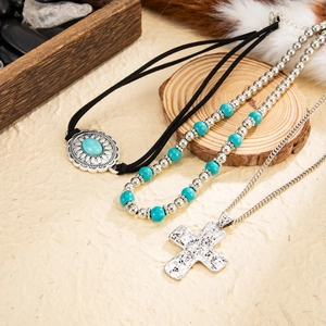 Bohemian style necklace set with turquoise stone pendant and silver cross detail