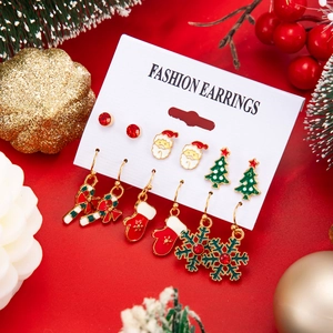 Detailed set of six Christmas earrings featuring Santa, tree, and reindeer designs