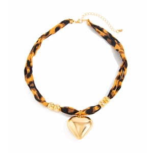 Detail of leopard print fabric necklace with large gold heart pendant and beads