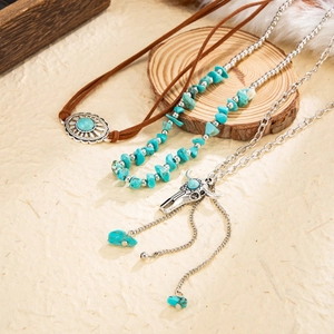 Bohemian turquoise bead necklace set with bull skull and silver cross pendants