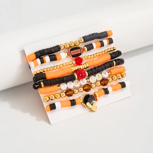 Detail of multi-layer elastic football bracelets with clay beads and GAME DAY charms