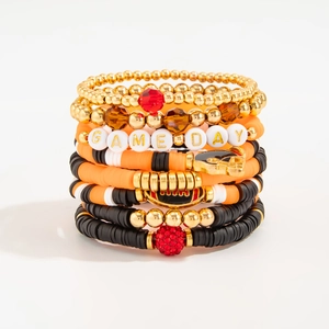 Detail view of Game Day bracelet set with rugby charms and colorful heishi beads