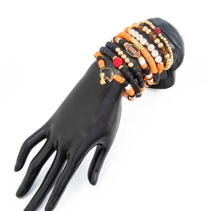 Detail of football-themed multi-layer bead bracelets with GAME DAY charms and helmet pendant