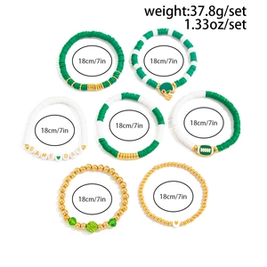 Detail of 7-piece Game Day stretch bracelet set with football charms and heishi beads