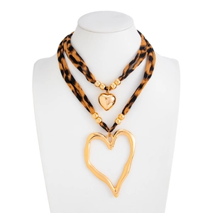 Detail of double-layer leopard print fabric necklace with golden heart-shaped pendants