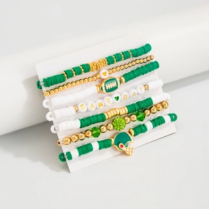 Detail of 7-piece green and gold beaded elastic bracelets with football theme charms